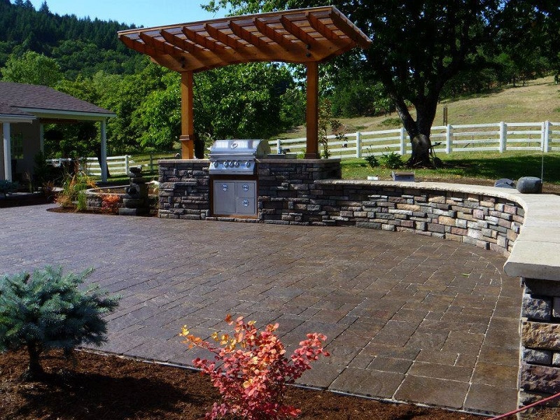 paver patio, outdoor kitchen, pergola, retaining wall