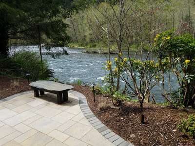 A backyard, riverfront oasis along the McKenzie patio landscape